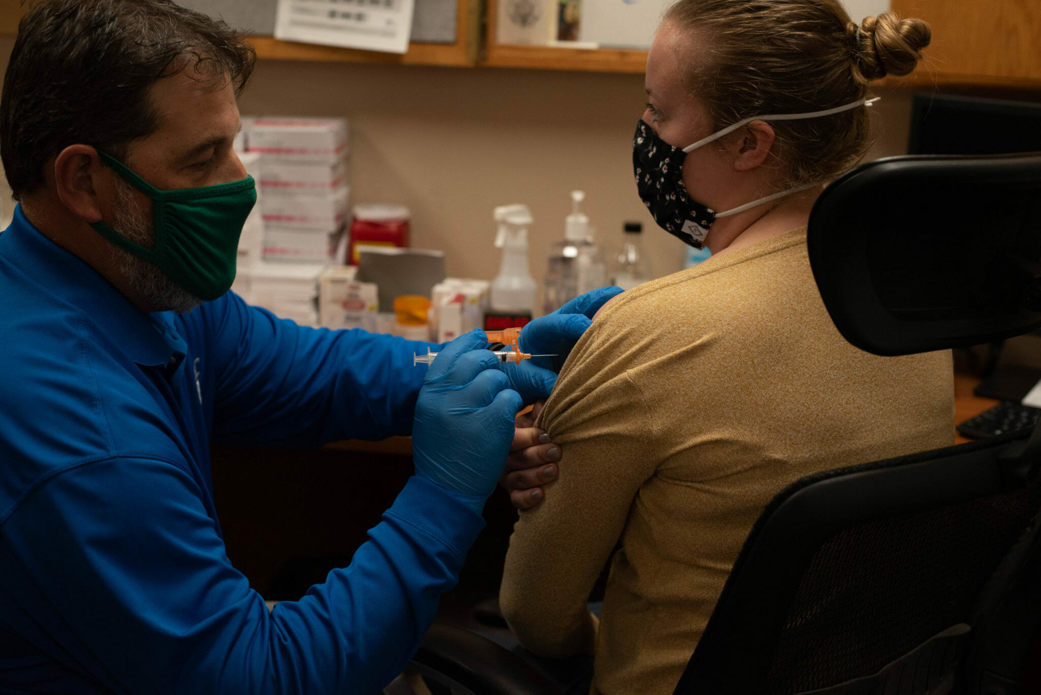 Woman receiving COVID-19 vacciation