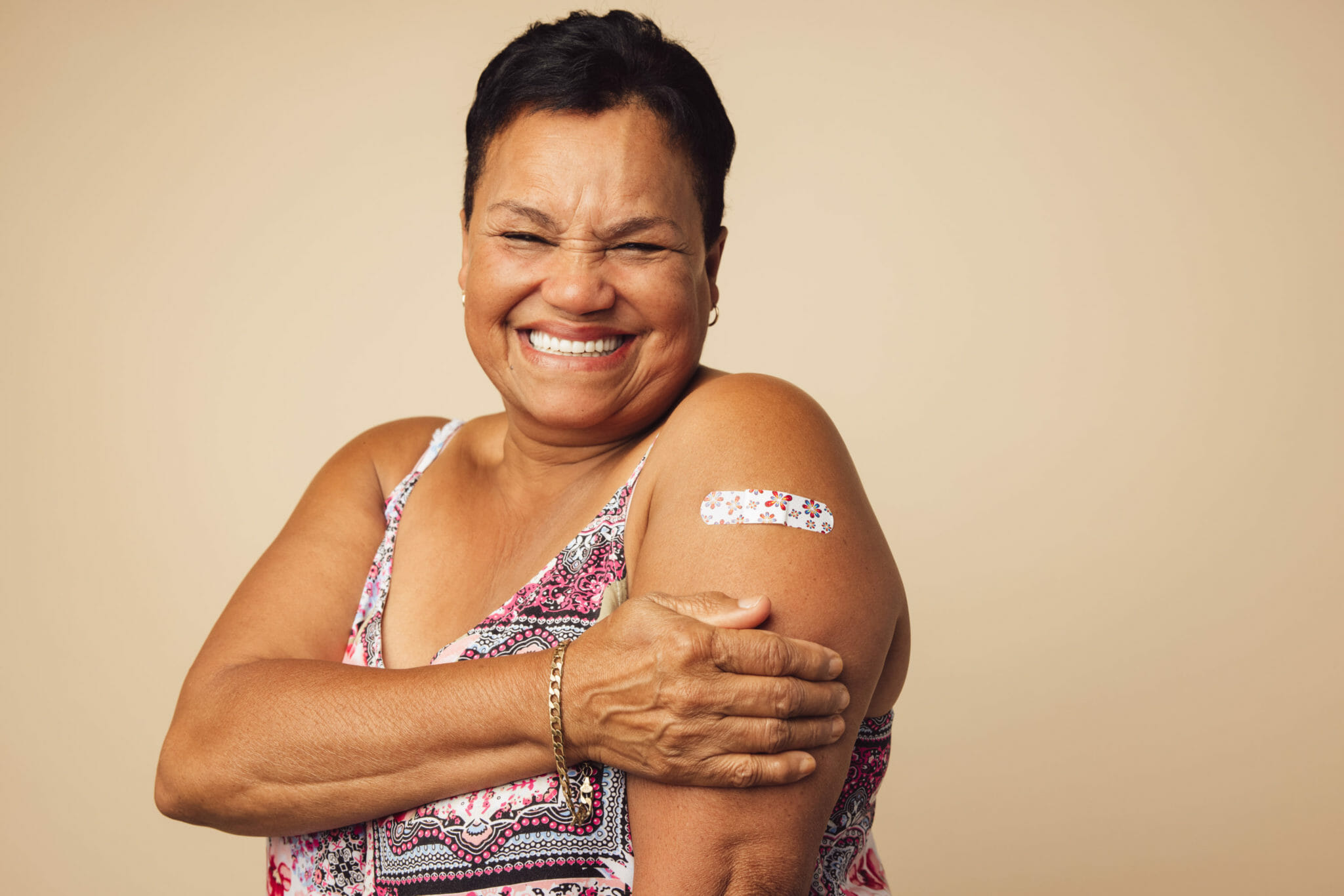 Senior smiling after vaccination