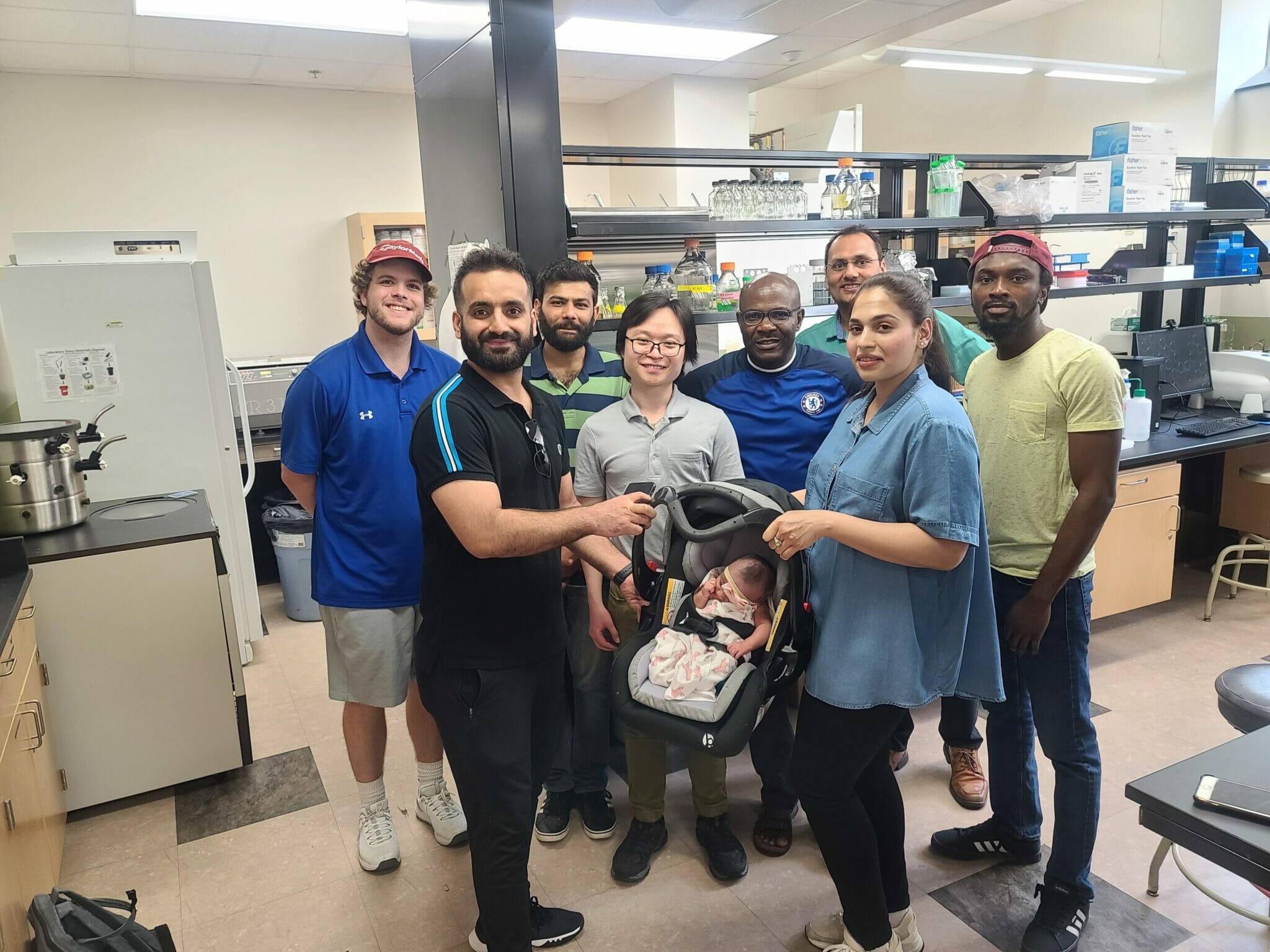 Visiting scholar Maria introduces her new baby to the lab