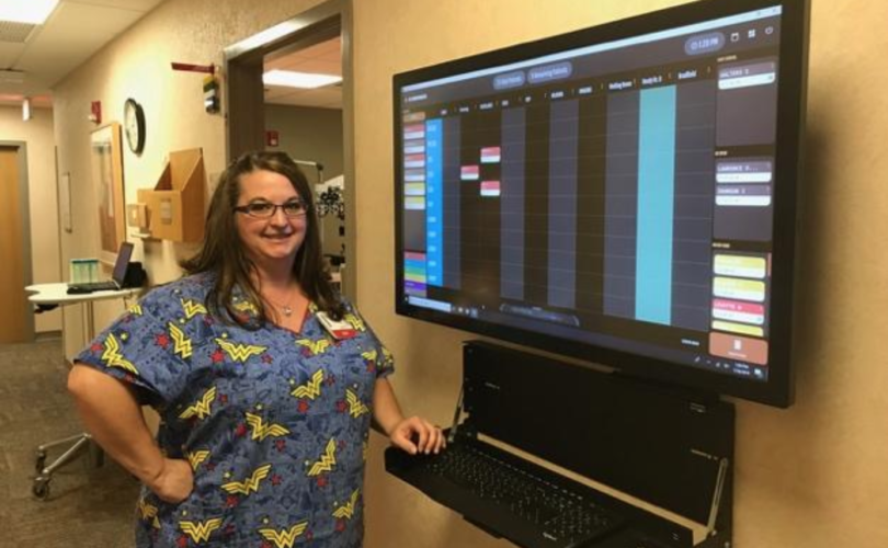 Darla Coullard, ophthalmic assistant, using the eSynchrony board.