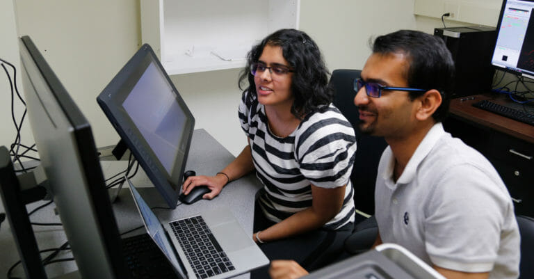 Hoon Lab researchers at computer