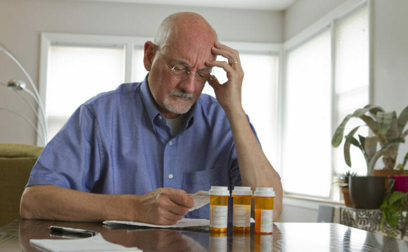 Man worried about prescription costs.
