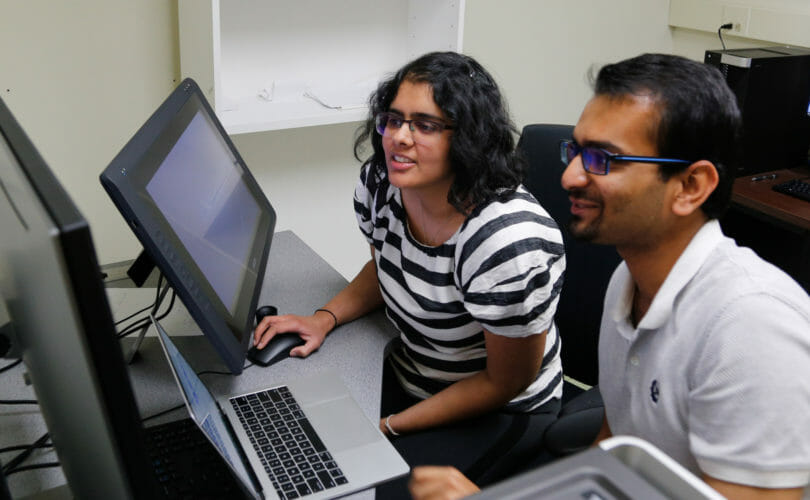 Hoon Lab researchers at computer