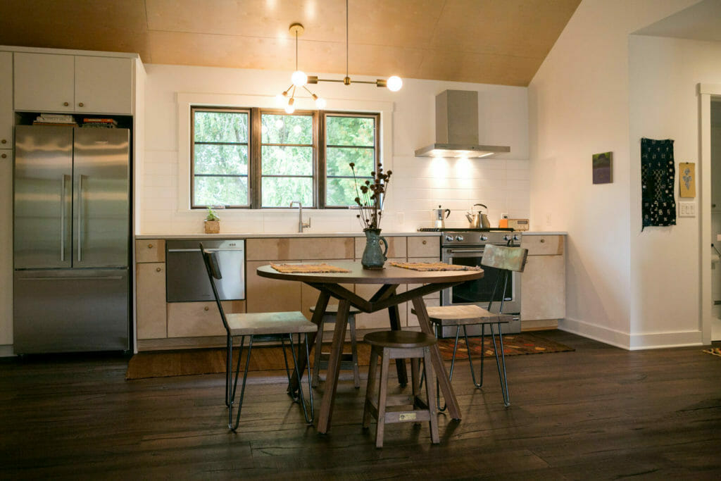 Lofted plywood ceilings, birch cabinets, stainless steel appliances and an open floor plan were part of the new kitchen in this whole house remodel in Monona, Wisconsin by TDS Custom Construction.